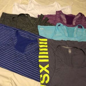 Six work out tops lightly if ever worn.